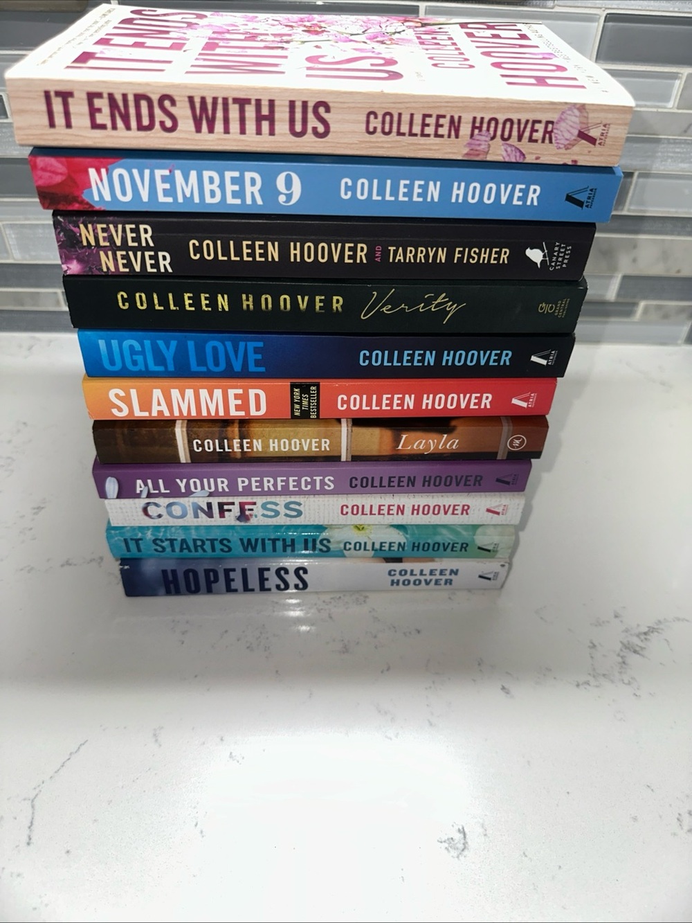 Lot of 11 Colleen Hoover paperbacks.